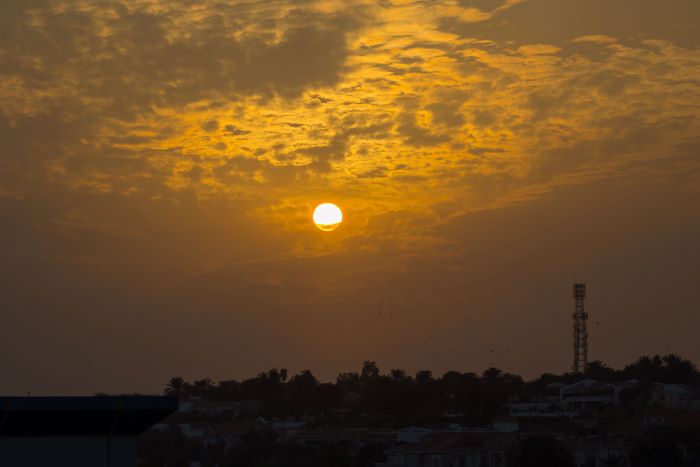 Sunset over a telecommunications mast.
