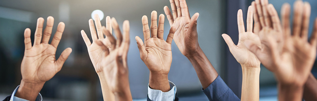 diverse hands raised in a row with suits signifying law firm diversity