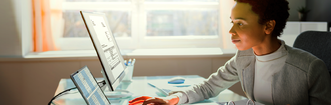 Black woman working on computer in law operations in a law firm or legal department